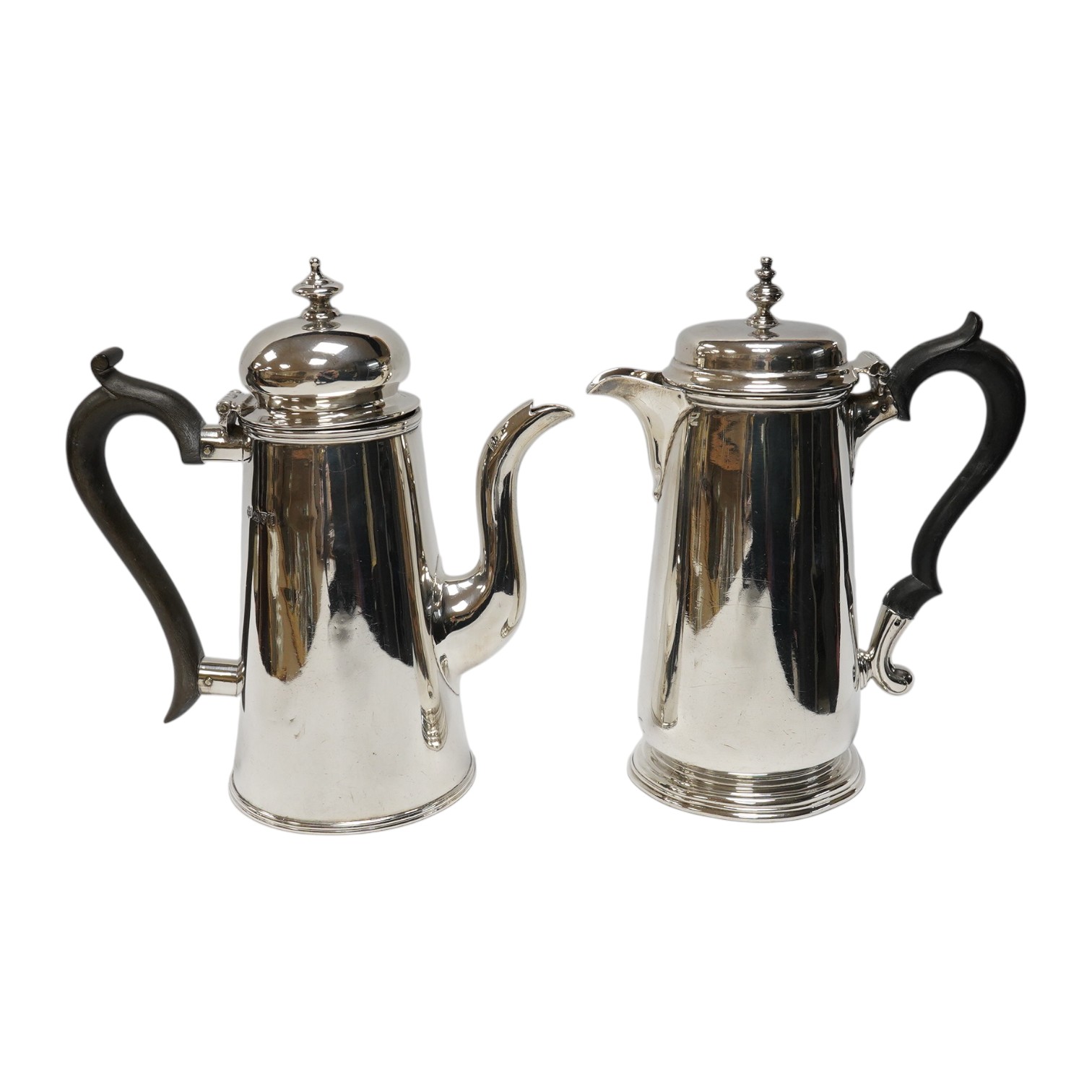 Two Edwardian silver cafe au lait pots, Pearce & Sons, London, 1908 and Nathan & Hayes, Chester, 1905, gross weight 21.1oz. Condition - poor